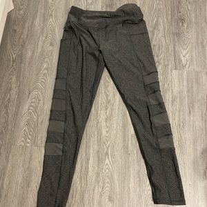 Gray Gottex leggings with mesh cutouts